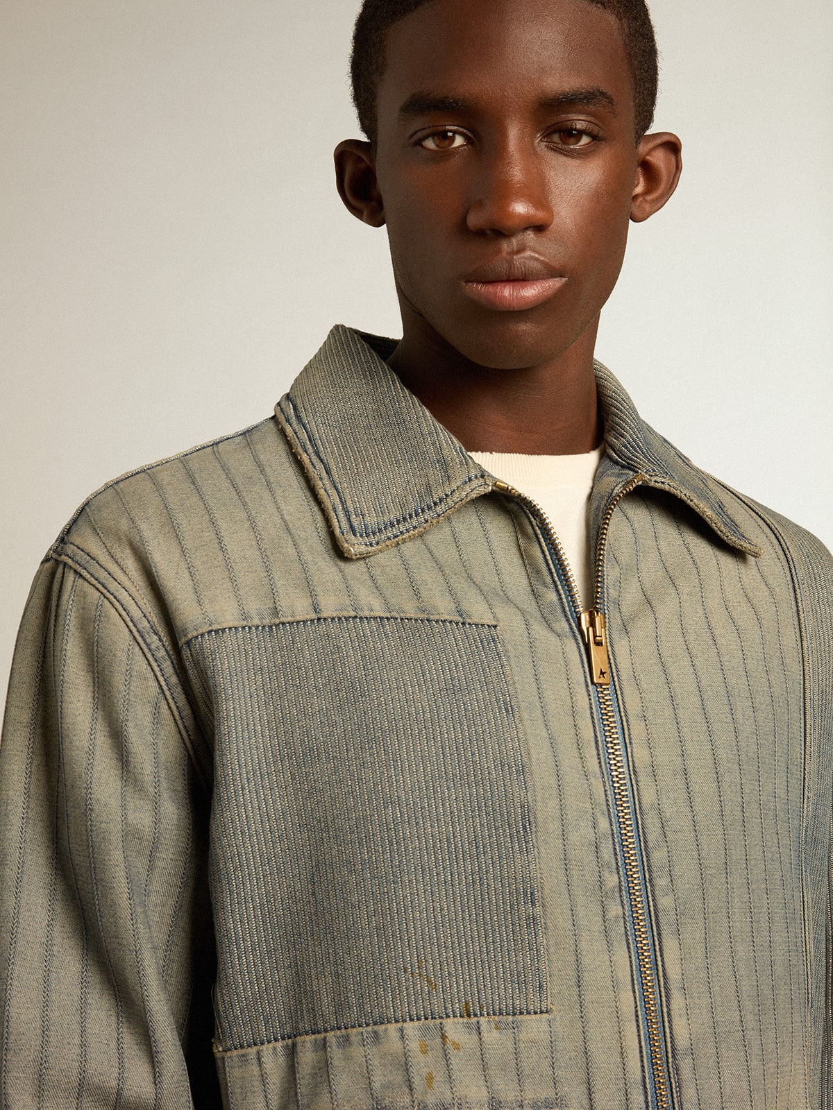 Men’s denim jacket with stripes and patches on the front