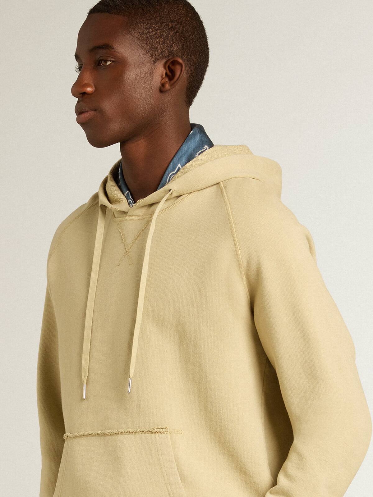Pale eucalyptus-colored hoodie with front pocket