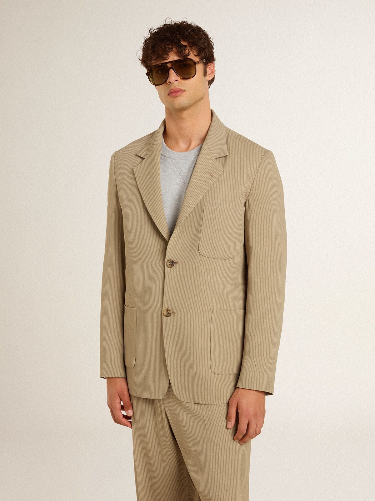 Men's beige pinstripe single-breasted jacket with an oversized fit