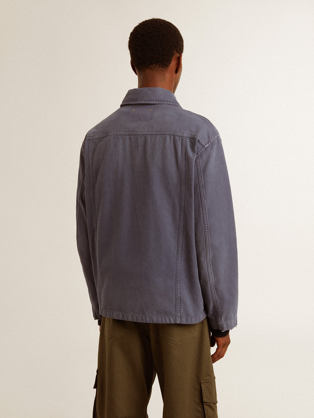 Men's blue jacket in denim cotton with distressed treatment