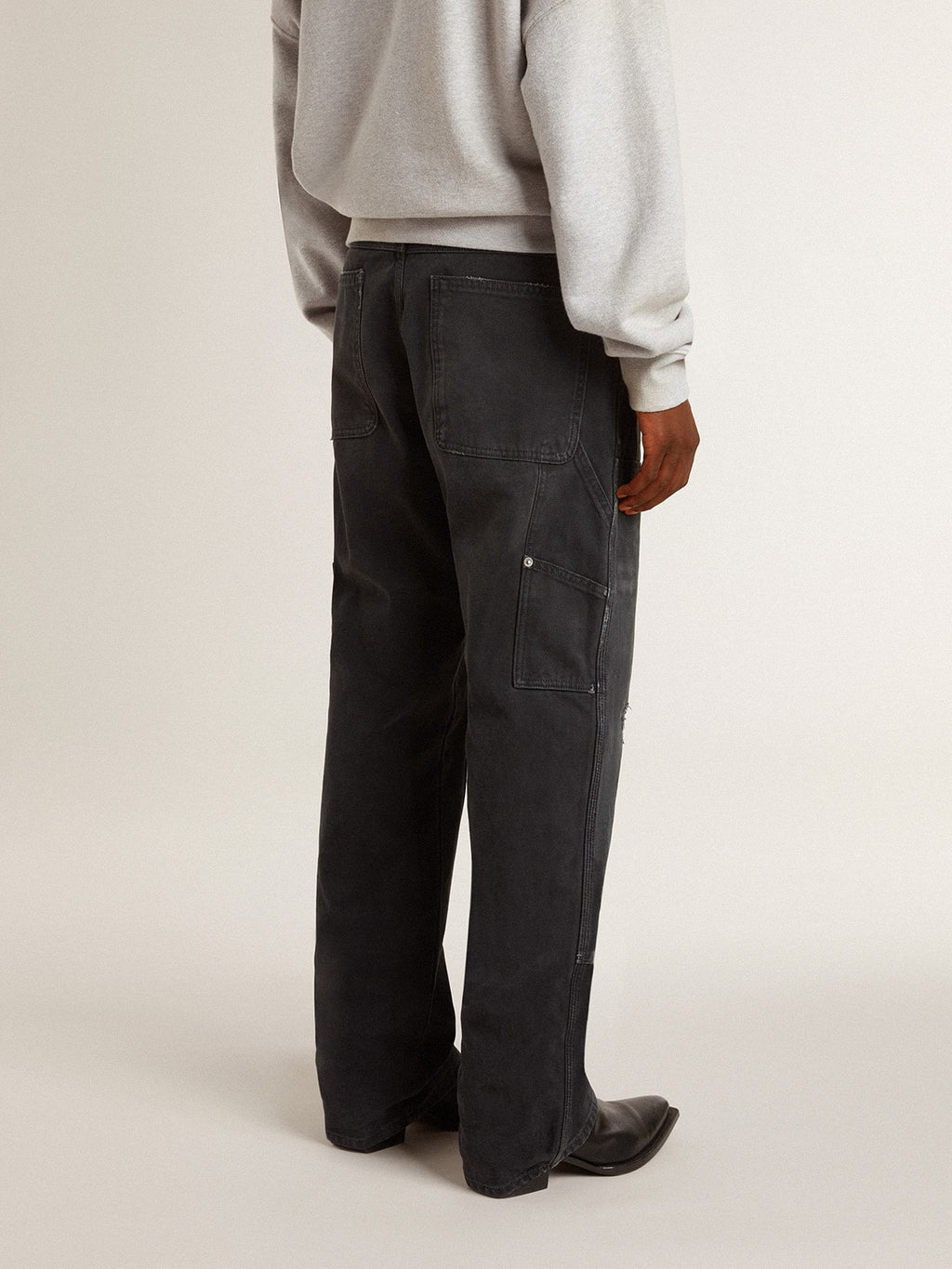 Men's distressed black cotton jeans with front patches