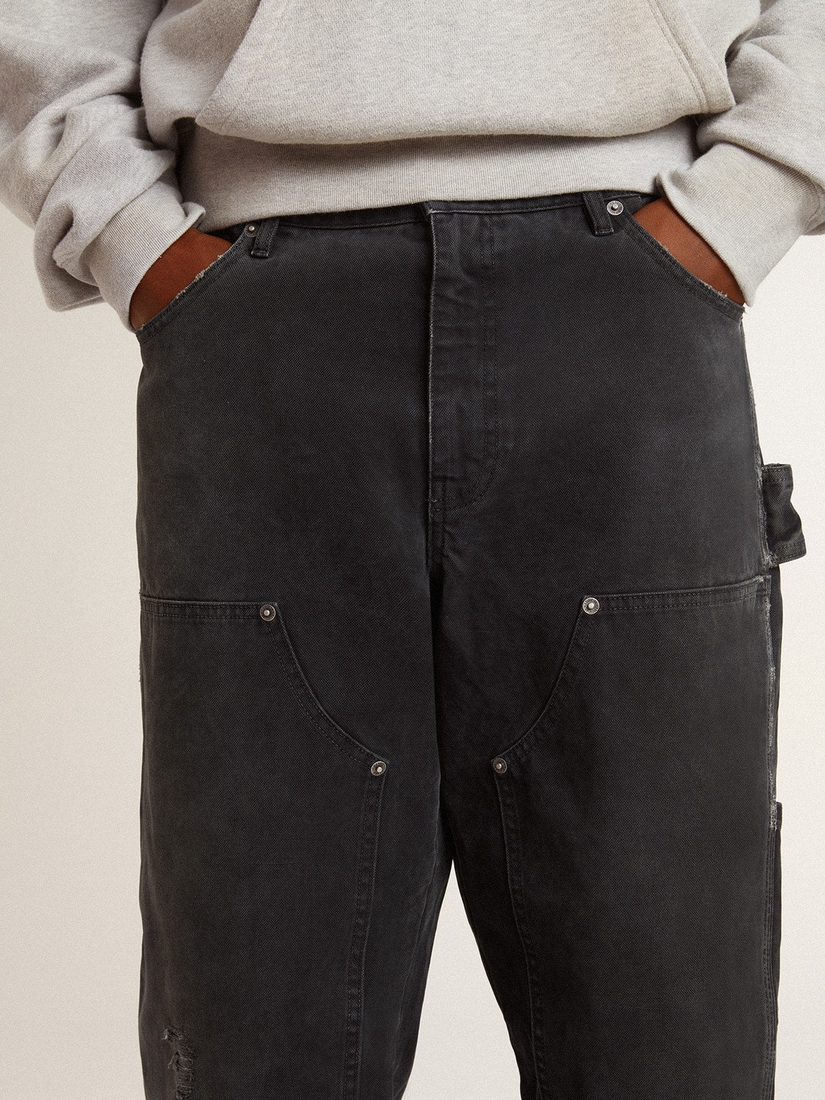 Men's distressed black cotton jeans with front patches