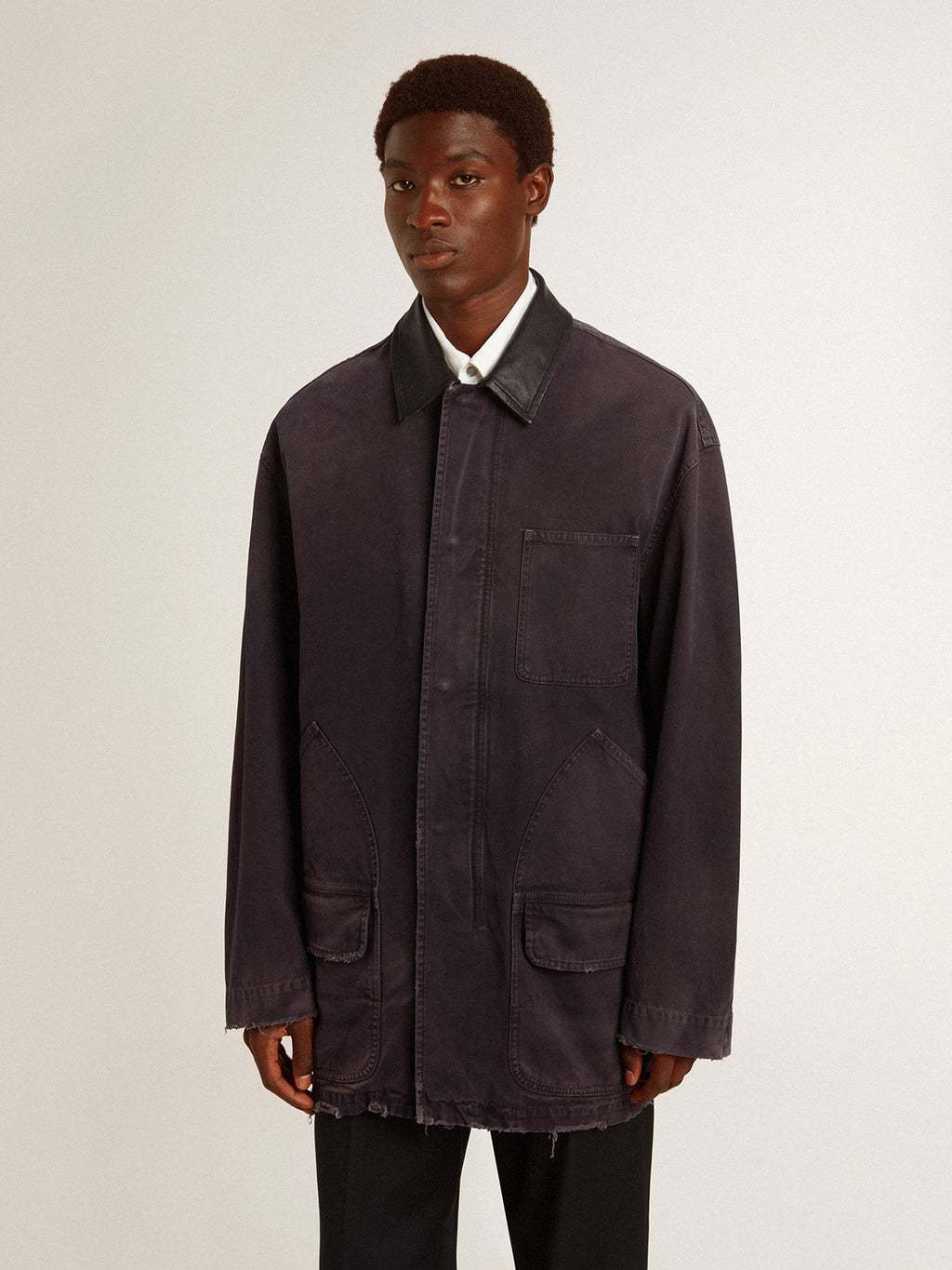 Men's denim jacket with distressed details and leather collar