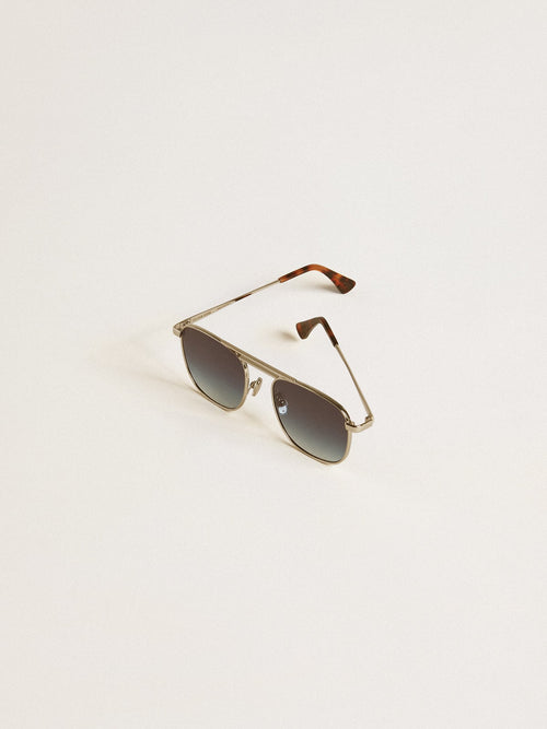 Aviator style sunglasses with silver frame and blue lenses