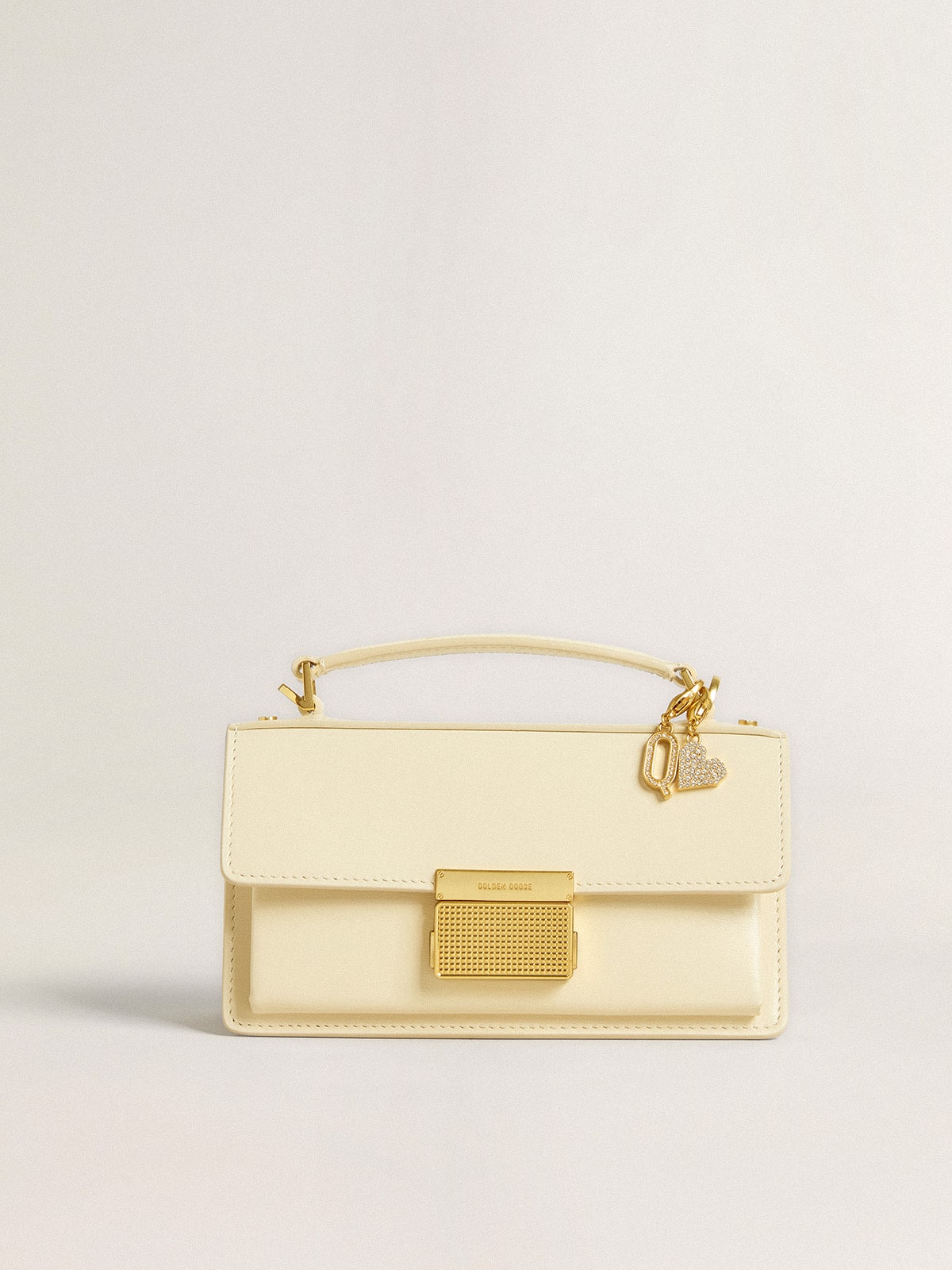 Letter Q charm in gold-colored brass with crystals