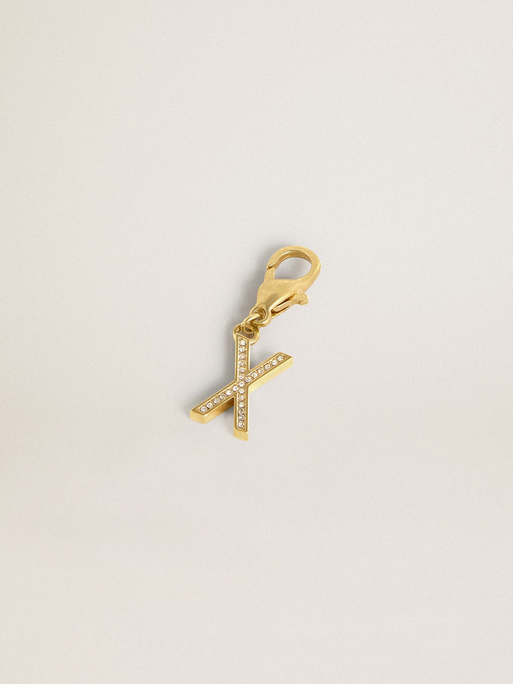 Letter X charm in gold-colored brass with crystals