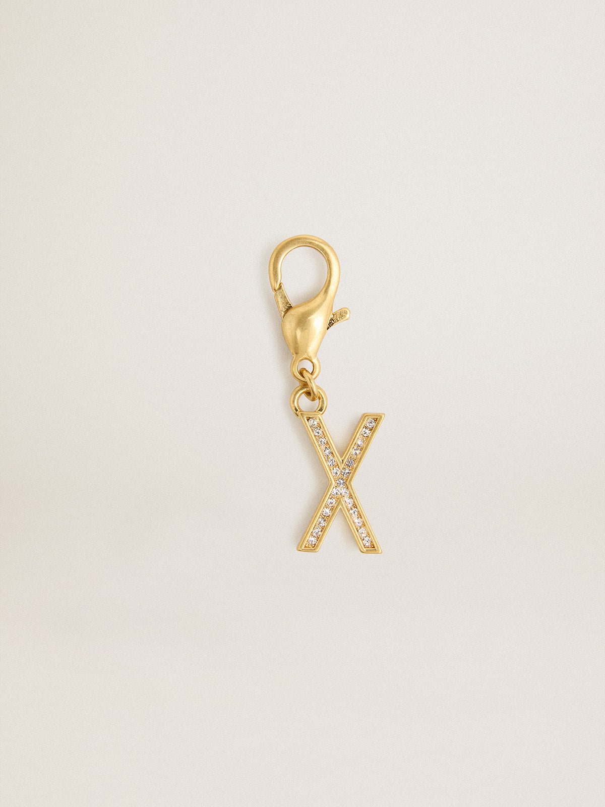 Letter X charm in gold-colored brass with crystals