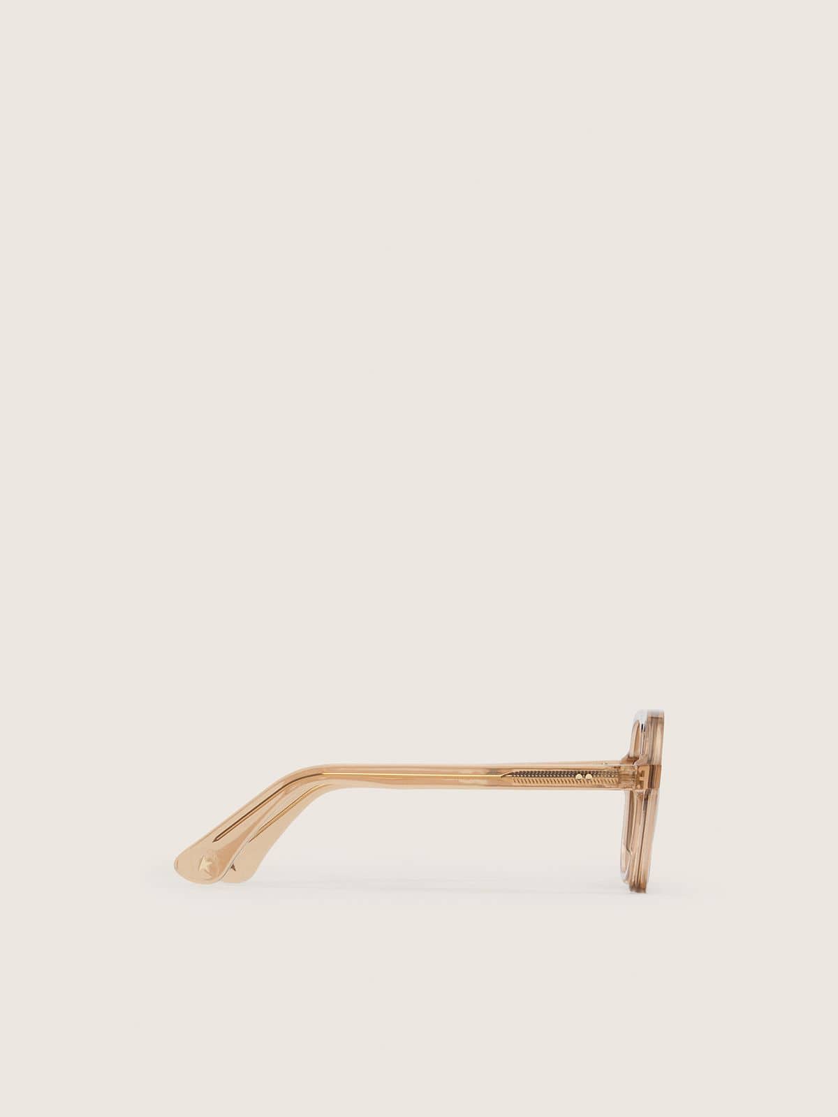 Aviator style sunglasses with honey-colored frame and lenses