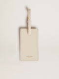 Worn white luggage tag