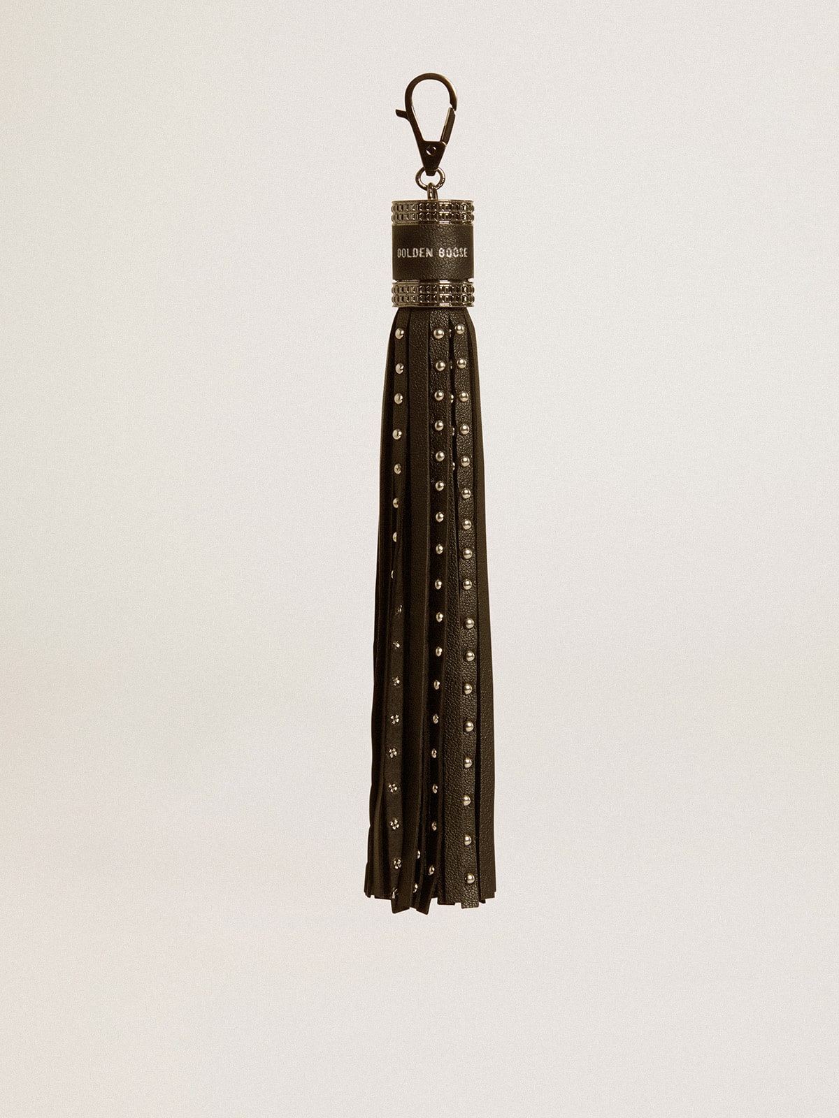 Charm in black nappa leather with studs and metal details