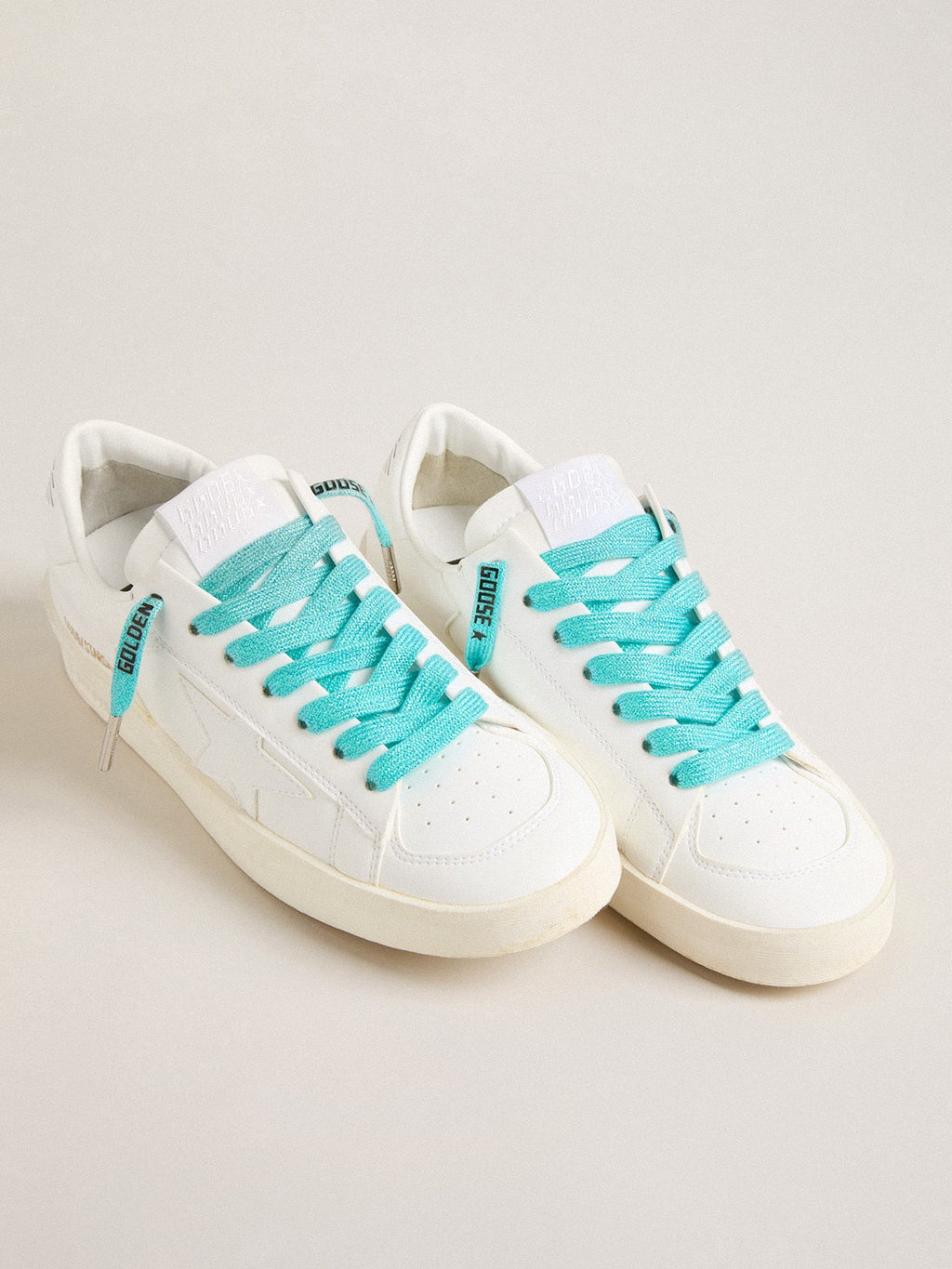 Light blue Lurex laces with contrasting black logo