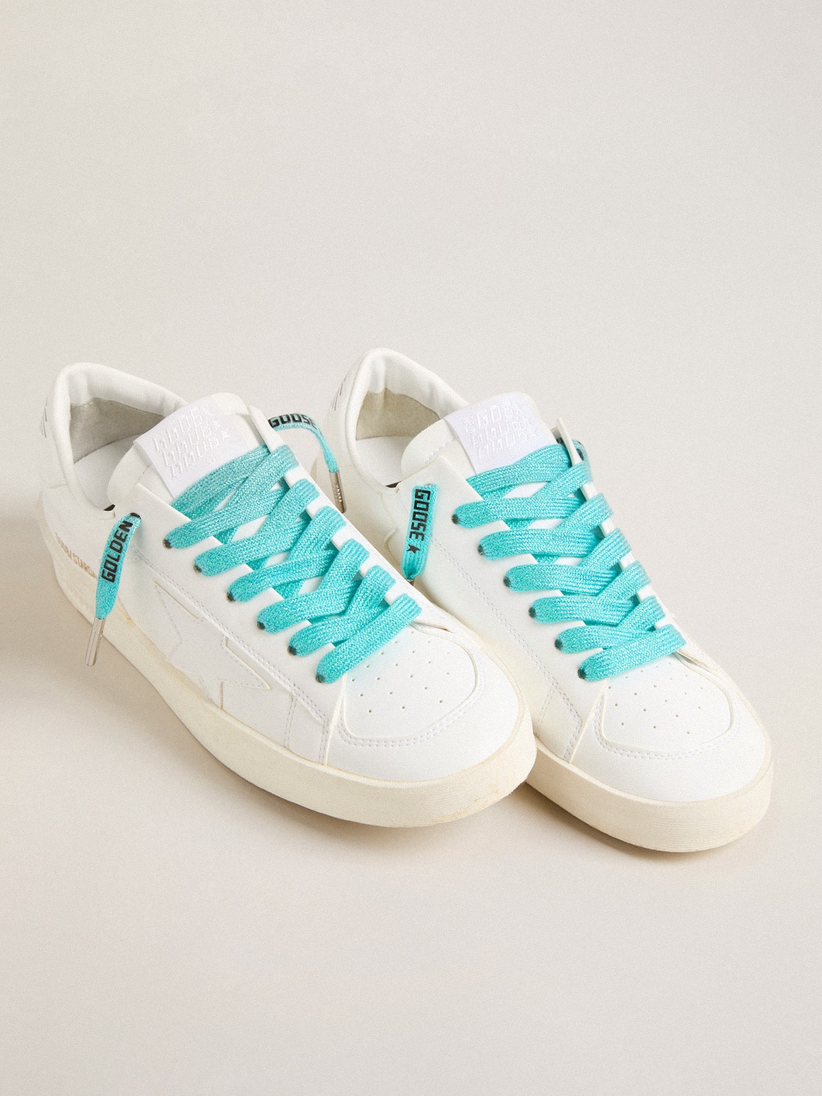 Light blue Lurex laces with contrasting black logo