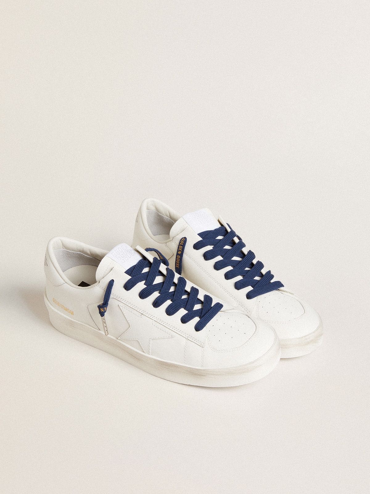 Navy blue cotton laces with contrasting gold logo
