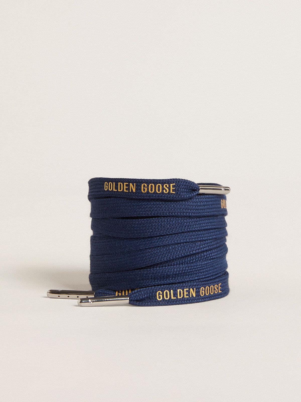 Navy blue cotton laces with contrasting gold logo