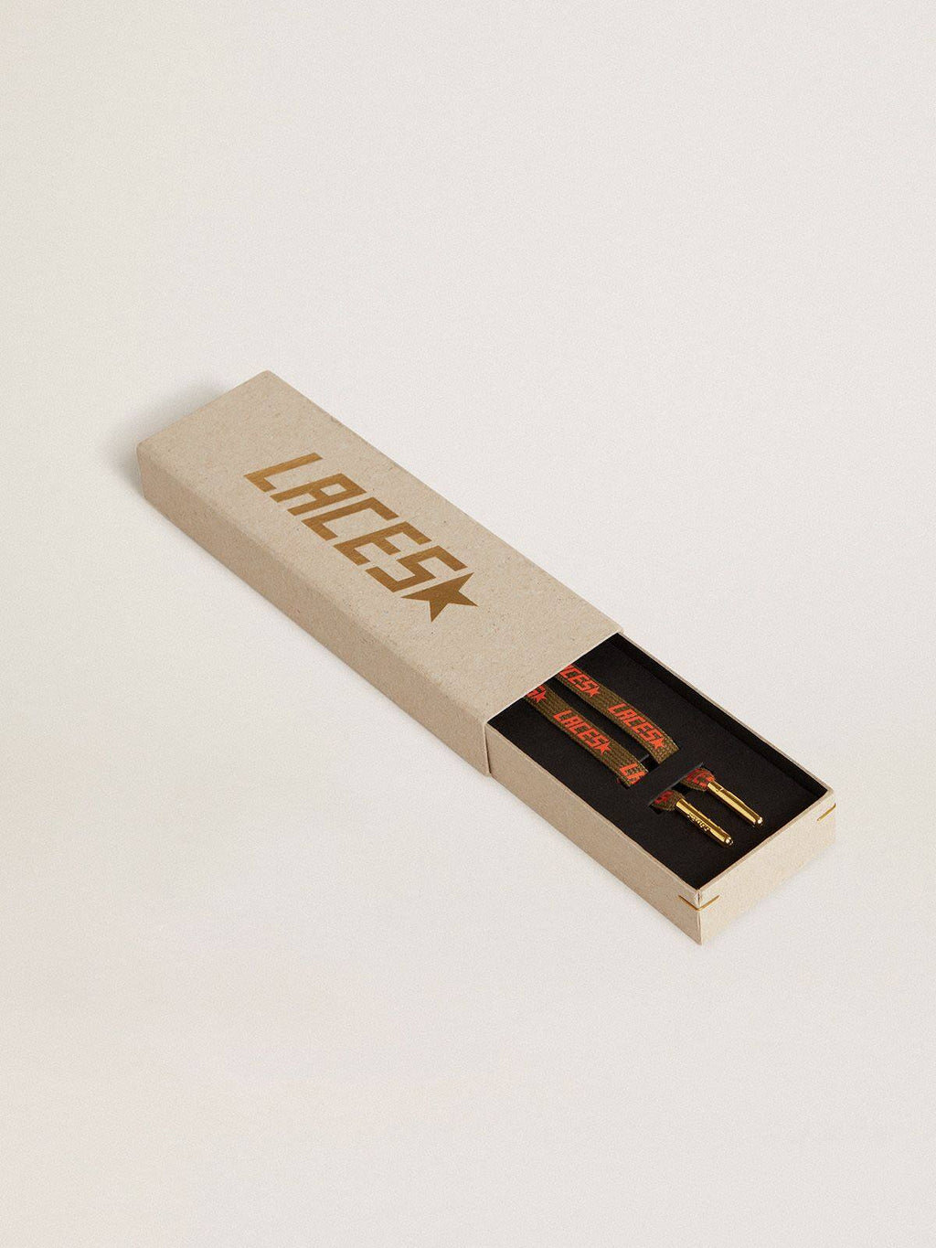 Military-green laces with contrasting orange ‘Laces’ lettering