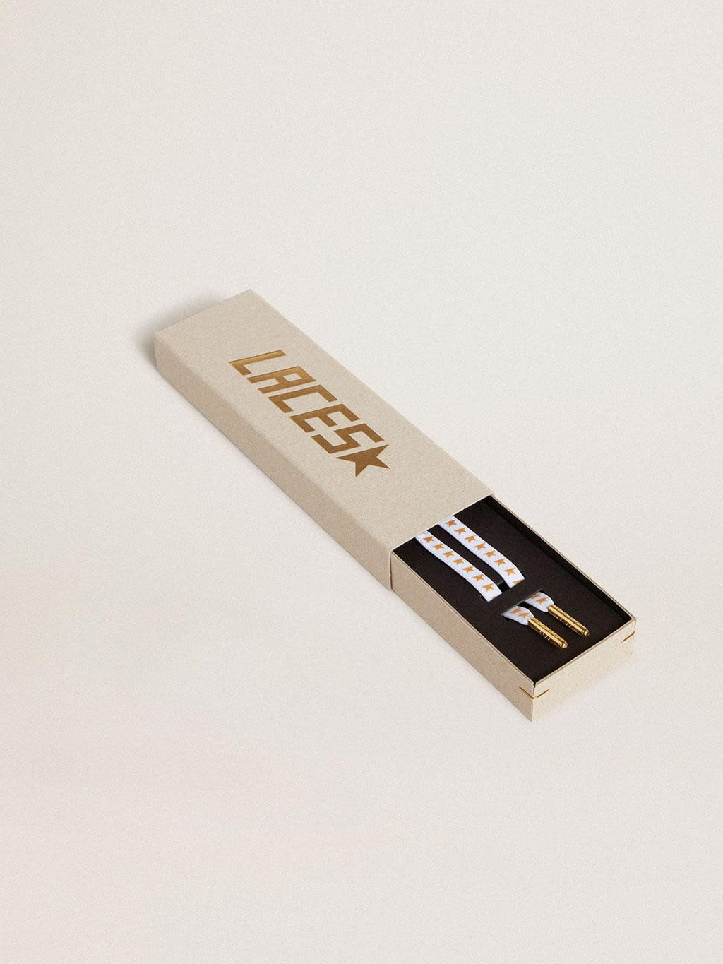 White cotton laces with contrasting gold stars