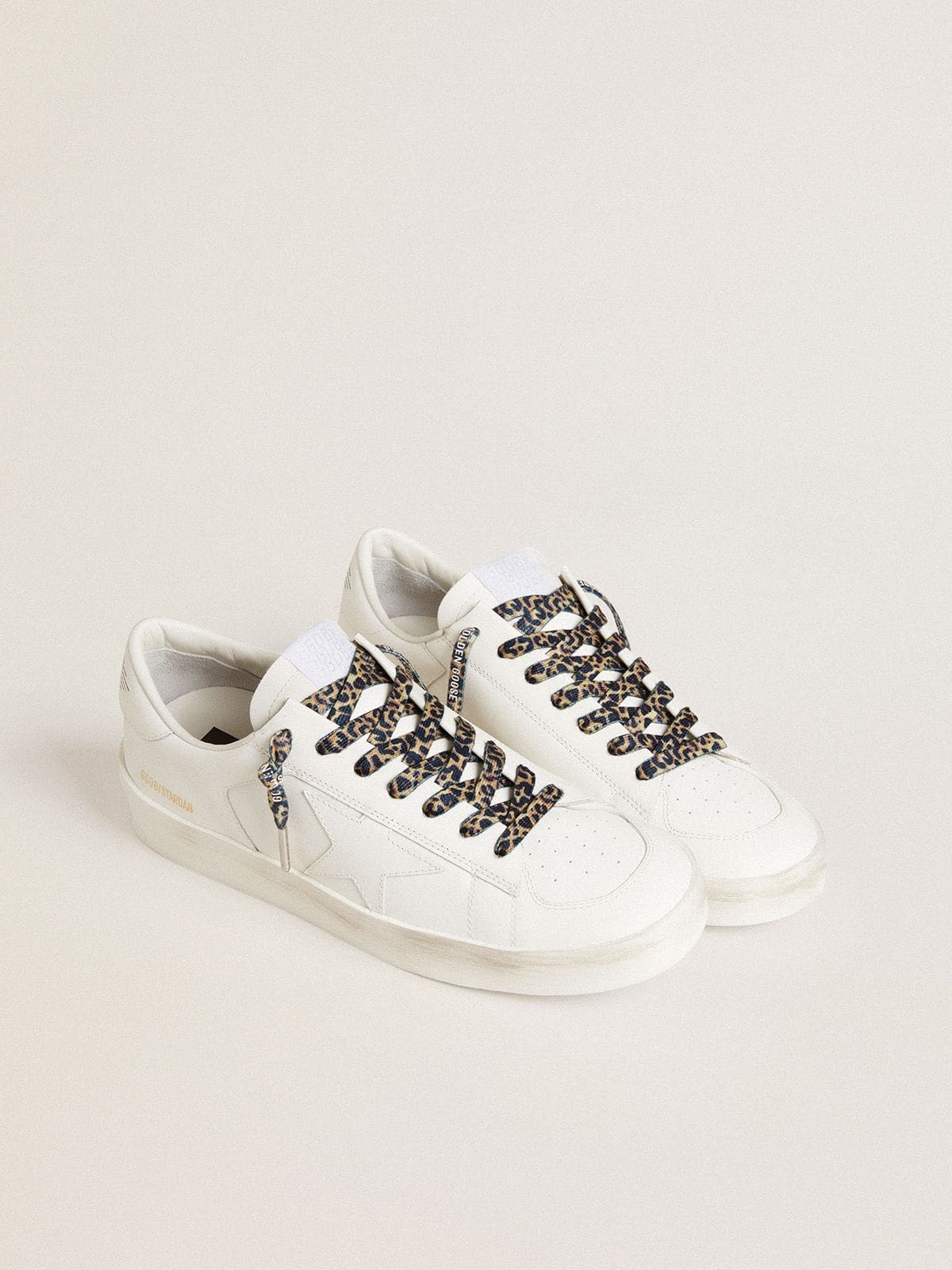 Beige leopard-print laces with contrasting white logo