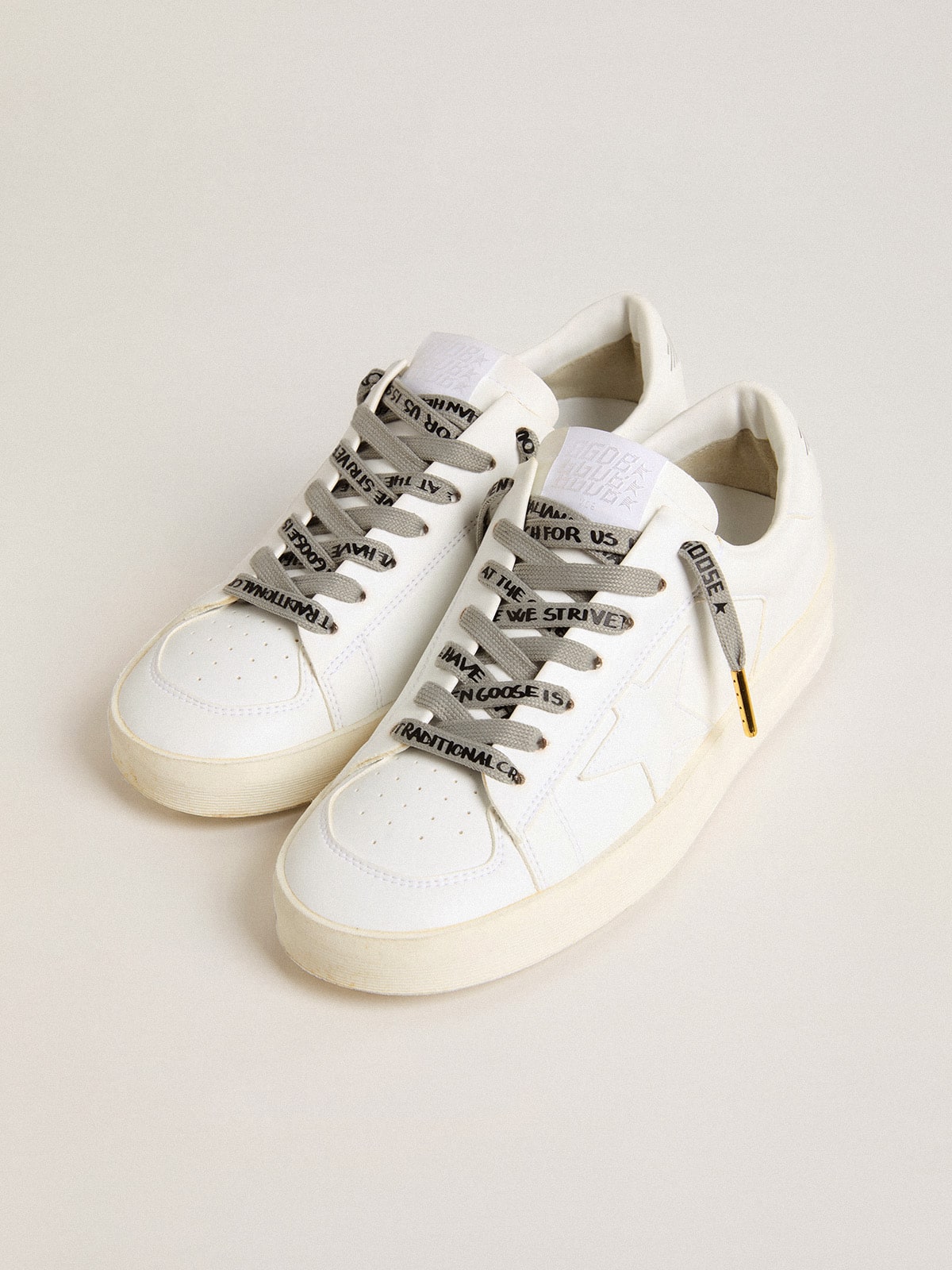 Gray cotton laces with contrasting black logo and lettering