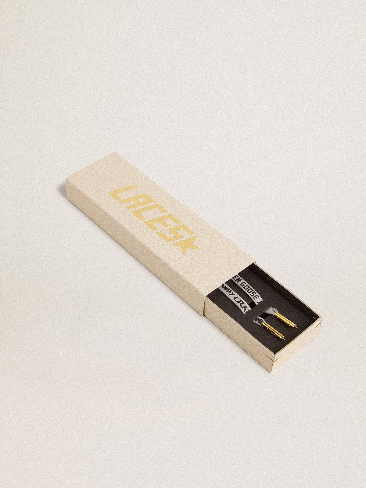 Gray cotton laces with contrasting black logo and lettering