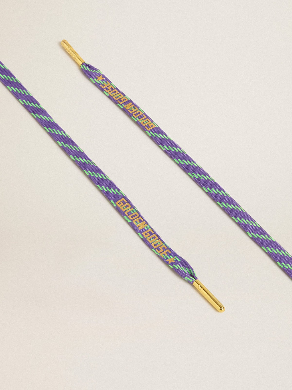 Neon green and purple cotton laces with contrast gold lettering