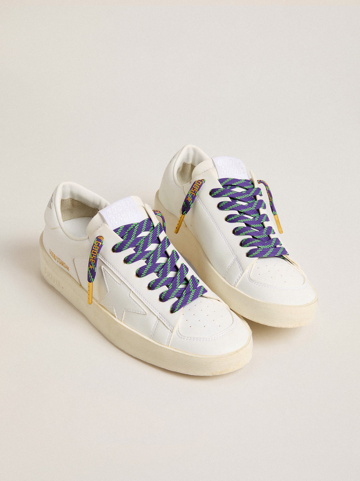 Neon green and purple cotton laces with contrast gold lettering