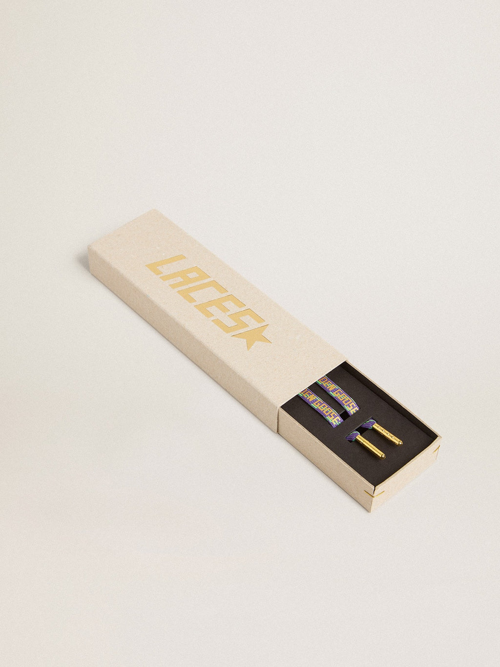 Neon green and purple cotton laces with contrast gold lettering