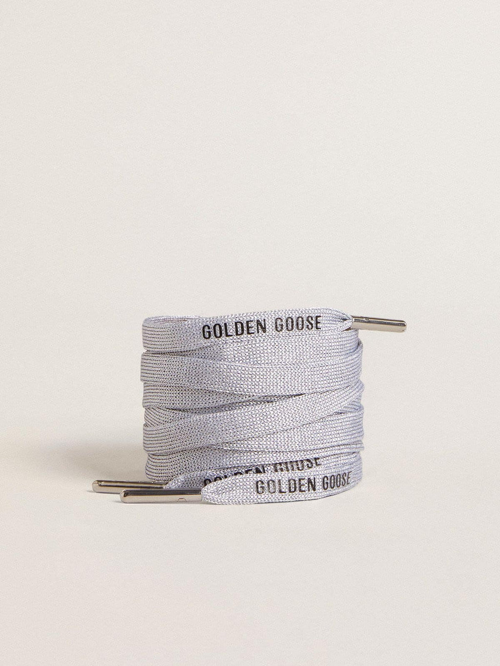 Silver-colored Lurex laces with contrasting black logo
