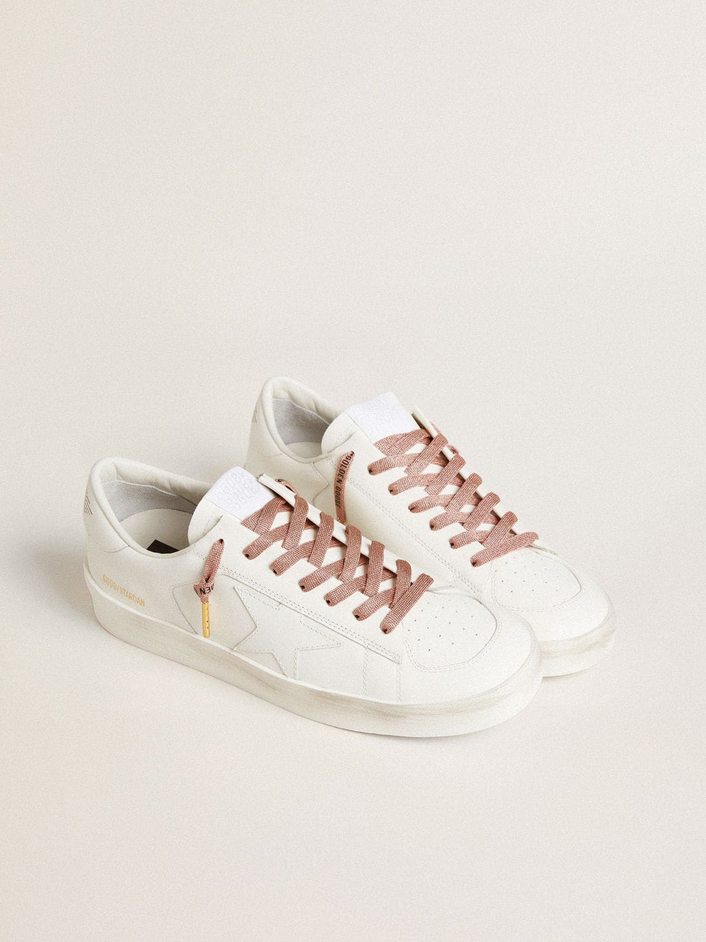 Salmon pink Lurex laces with contrasting black logo