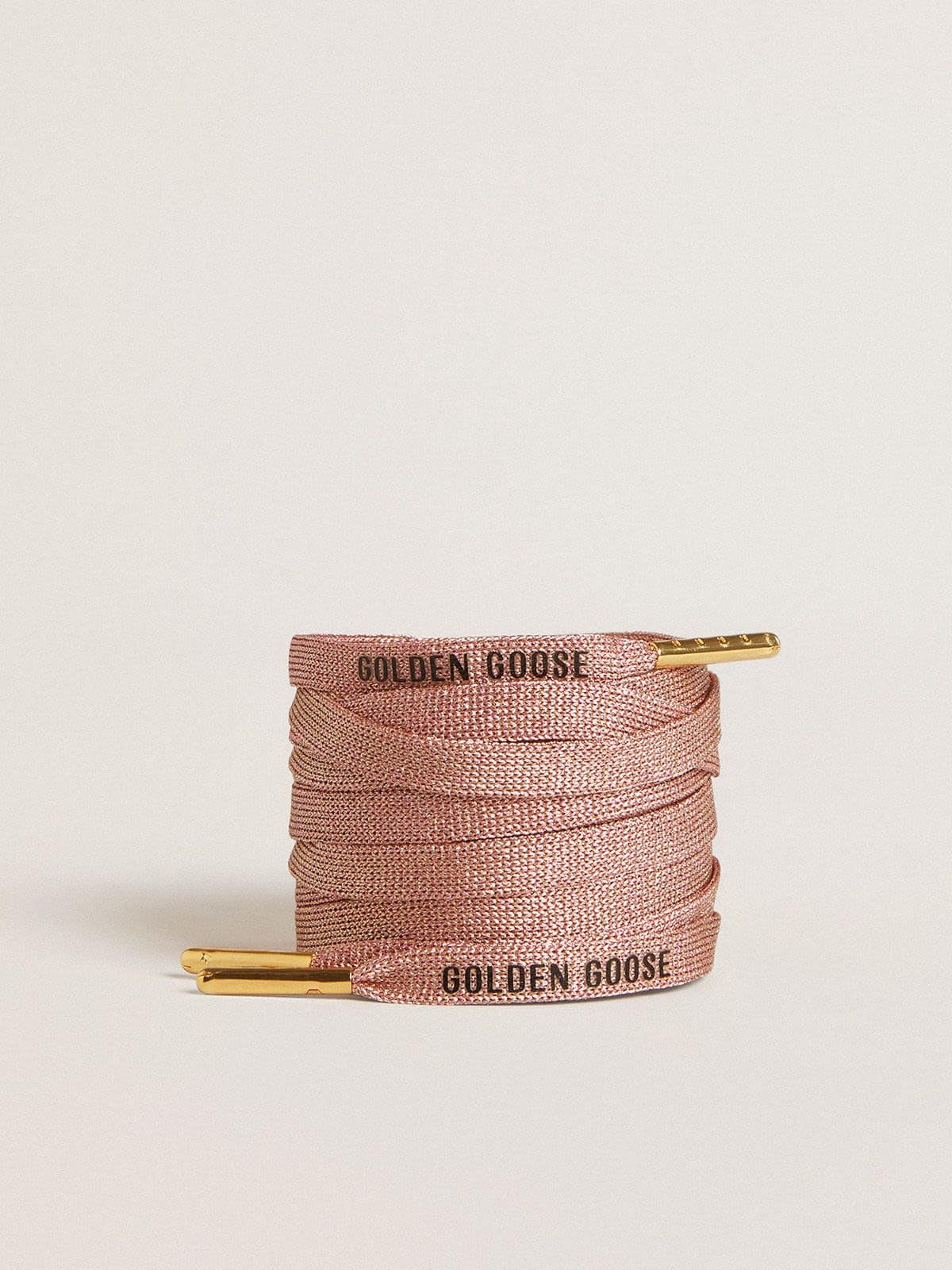 Salmon pink Lurex laces with contrasting black logo