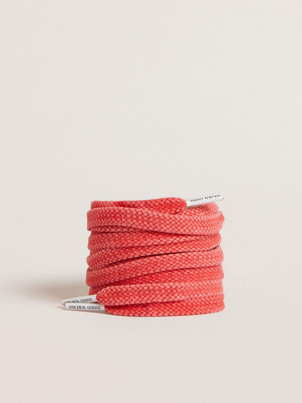 Worn-red cotton laces with logoed aglet