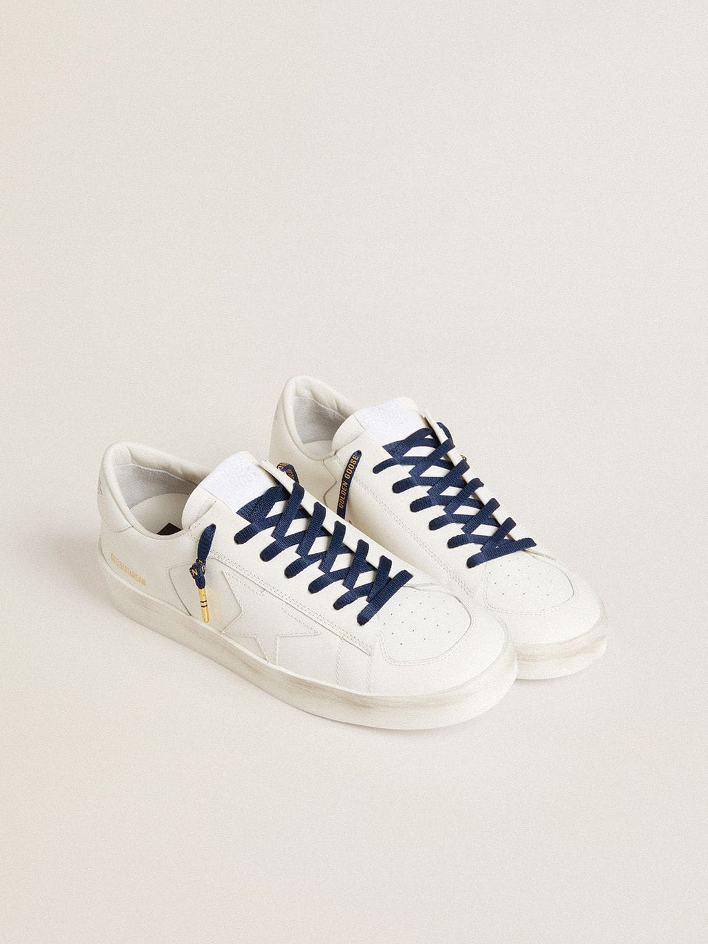 Blue cotton laces with contrasting gold-colored logo