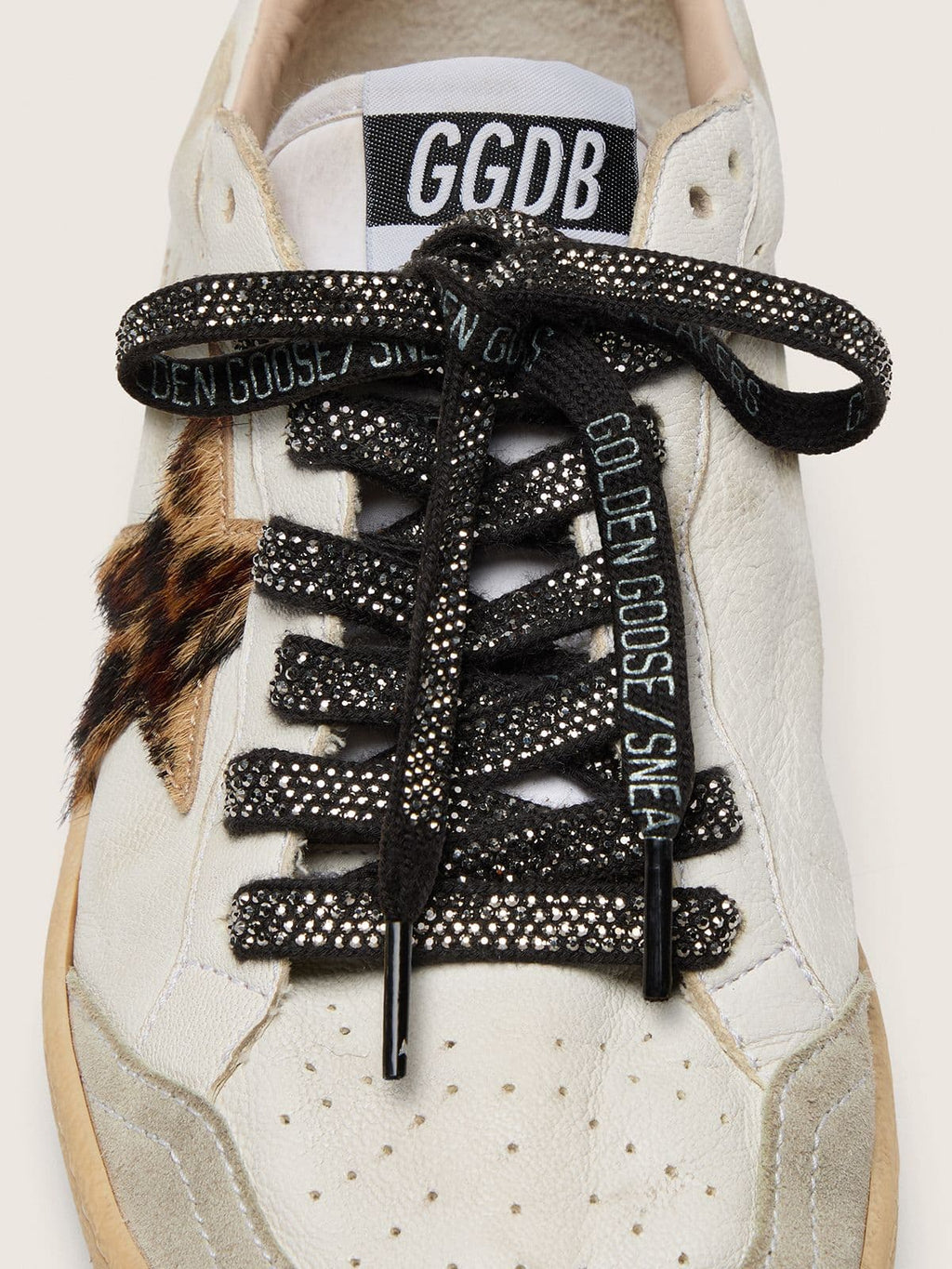 Black cotton laces with silver Swarovski crystals and white logo