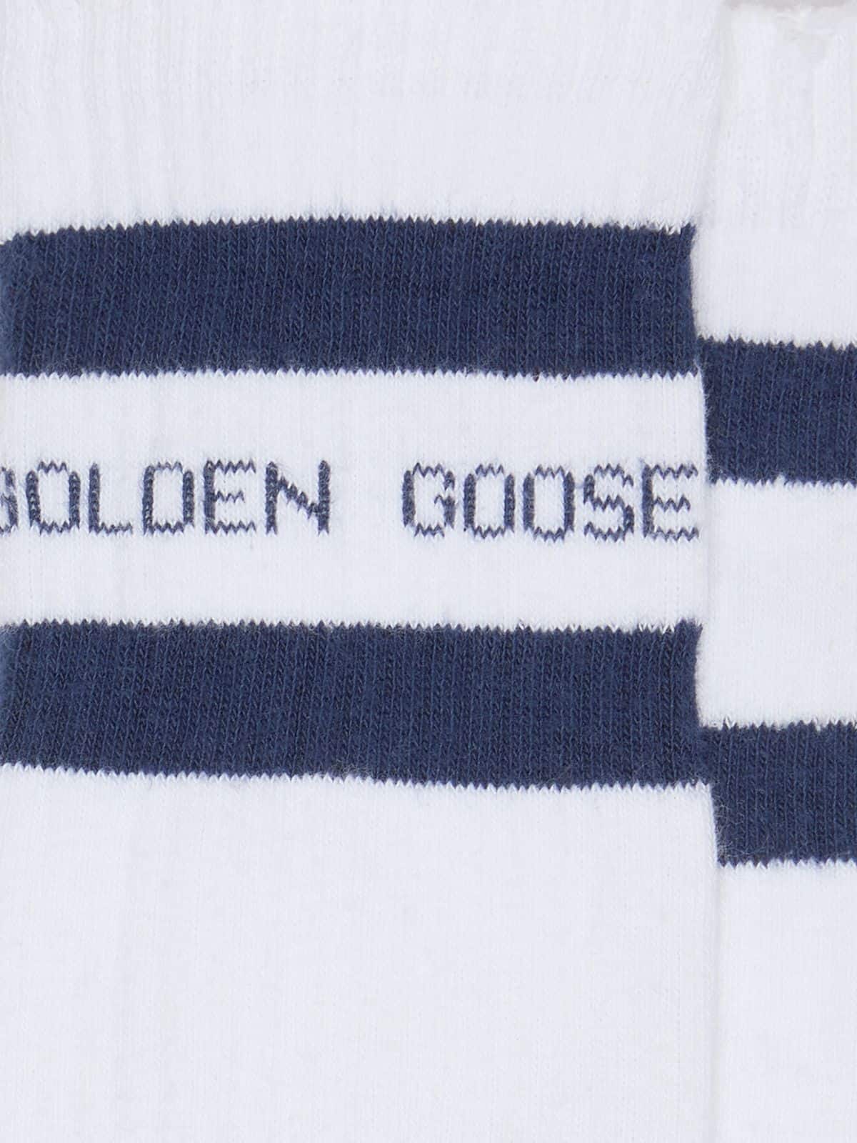 Cotton socks with distressed finishes, blue stripes and logo