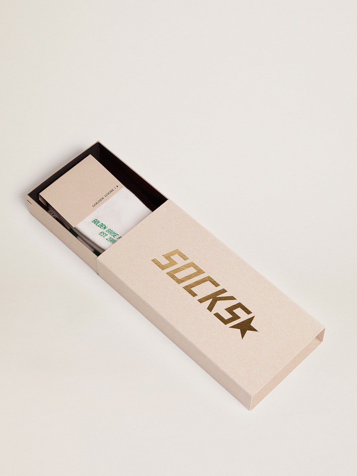 Cotton socks with distressed finishes, green stripes and logo