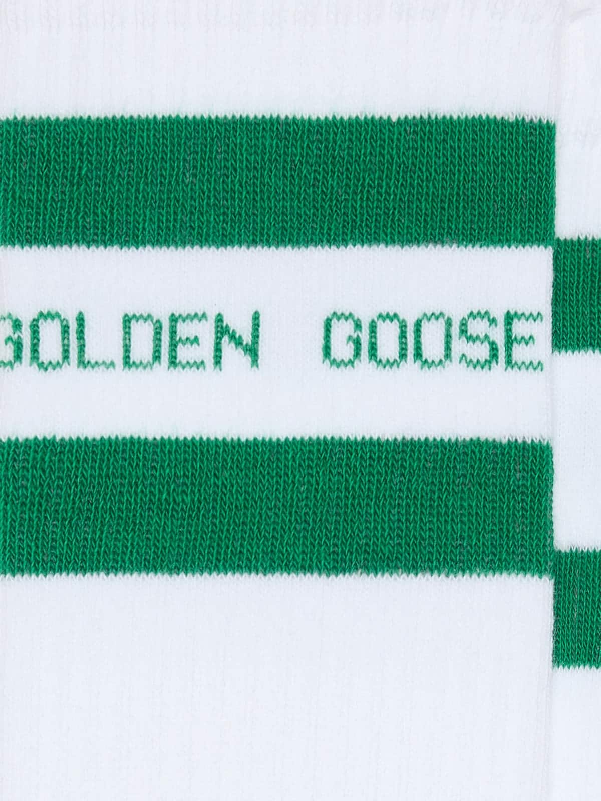 Cotton socks with distressed finishes, green stripes and logo
