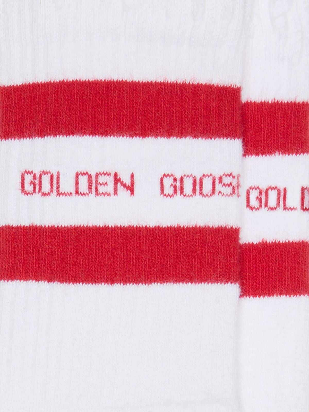 White socks with distressed details and red stripes