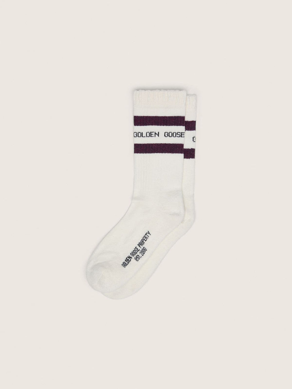 Worn-white socks with distressed details and brown stripes