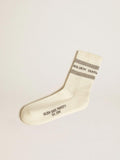Worn-white socks with distressed details and sage-green stripes
