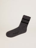 Grey socks with distressed details and dark brown stripes