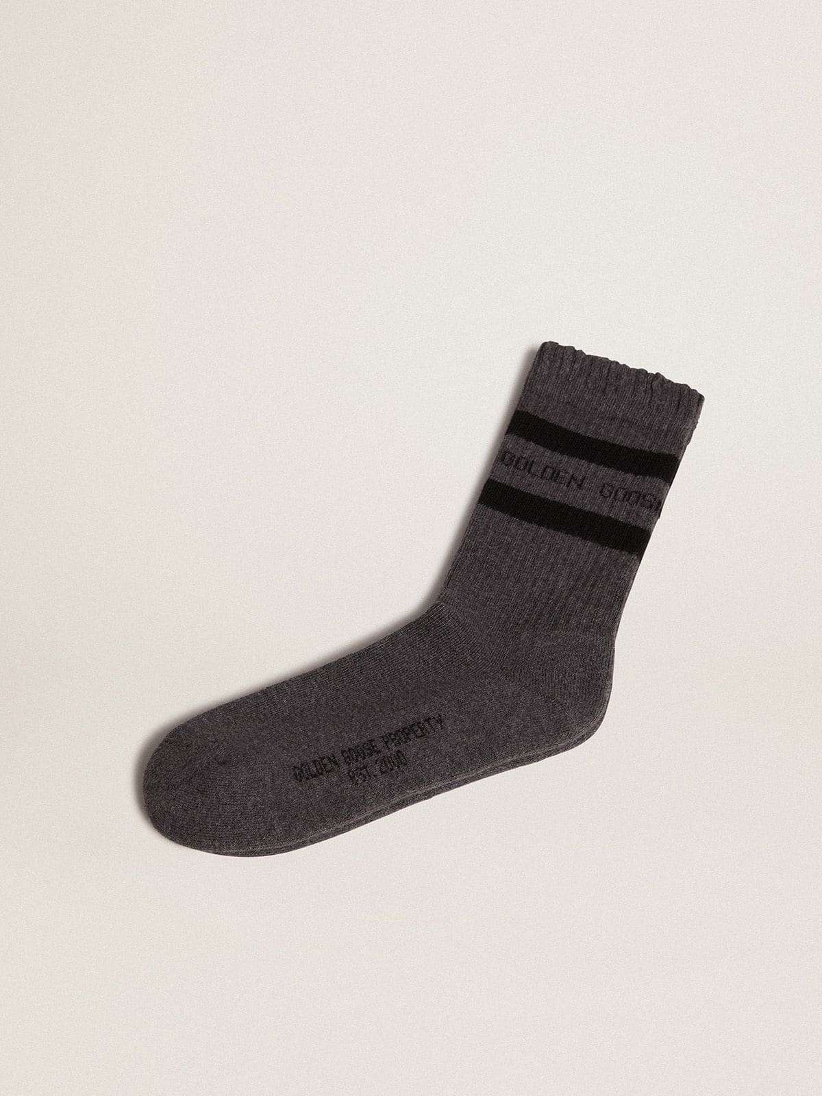 Grey socks with distressed details and dark brown stripes