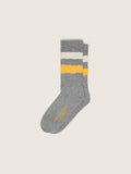 Gray socks with distressed details and yellow and white stripes