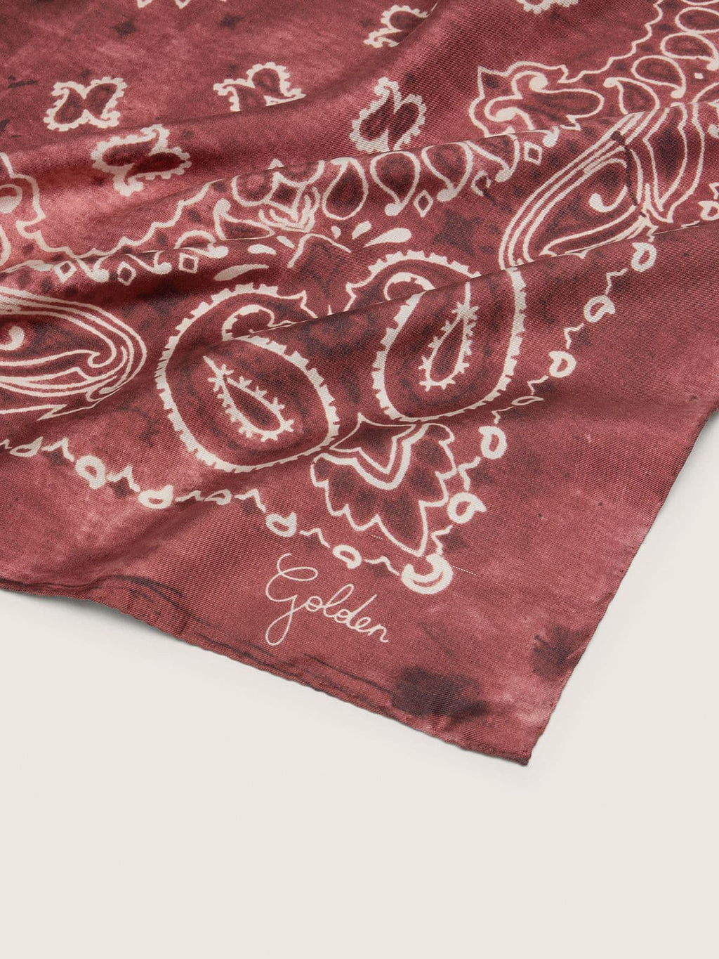 Burgundy scarf with paisley pattern