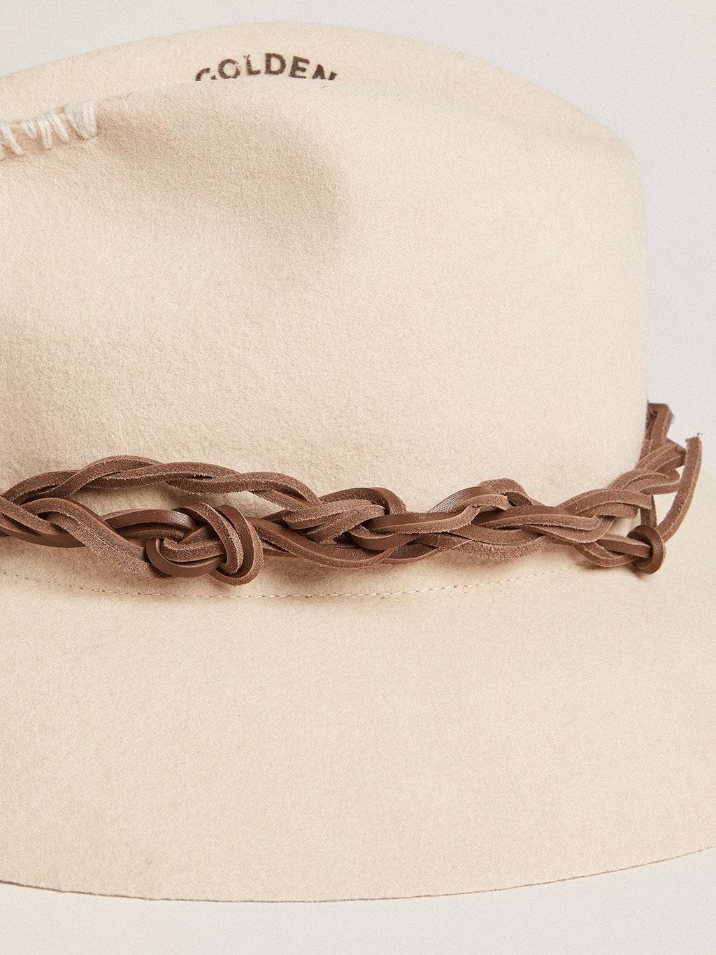 Parchment-colored fedora hat with leather band