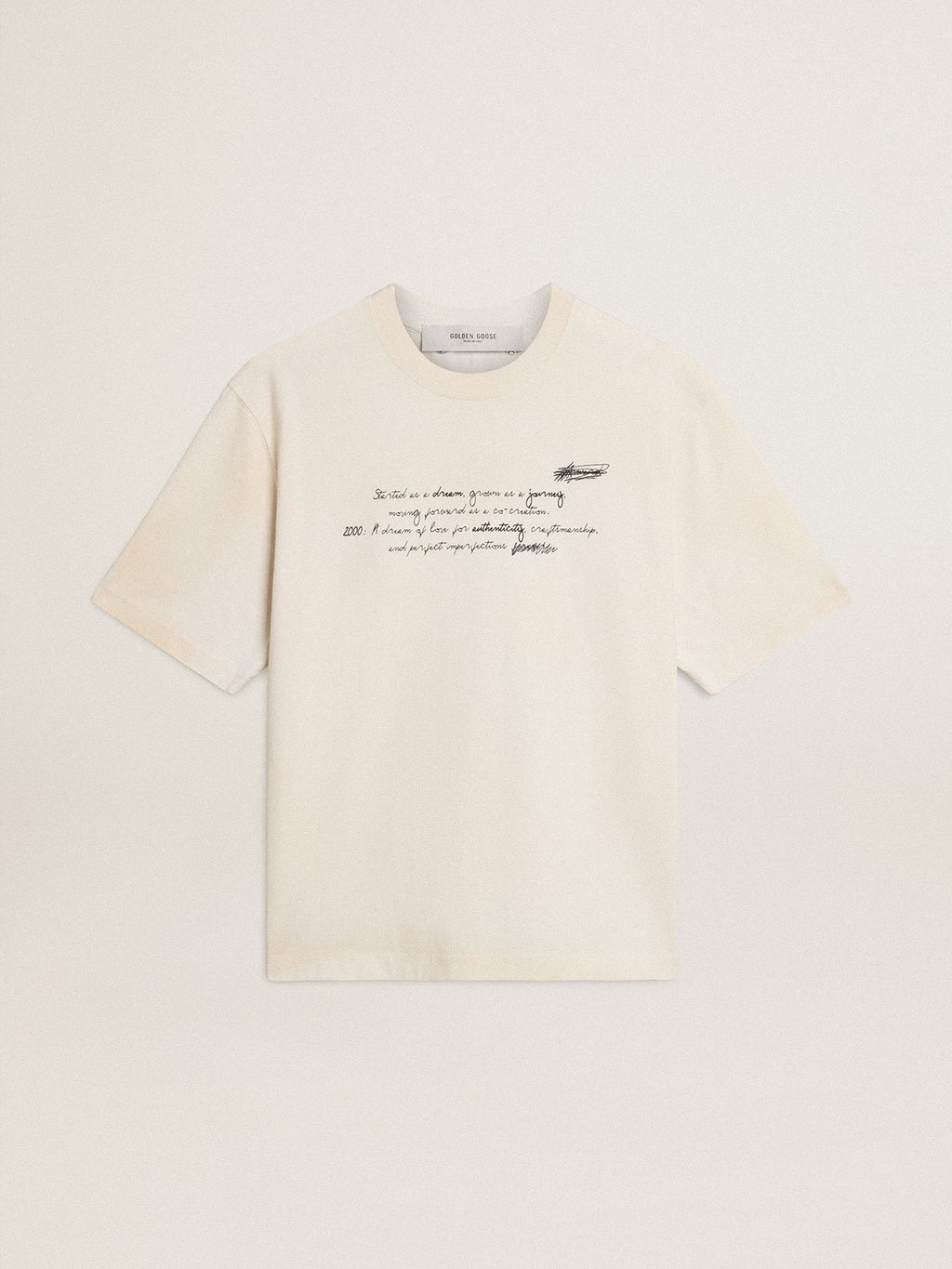 Worn-white unisex T-shirt with printed lettering