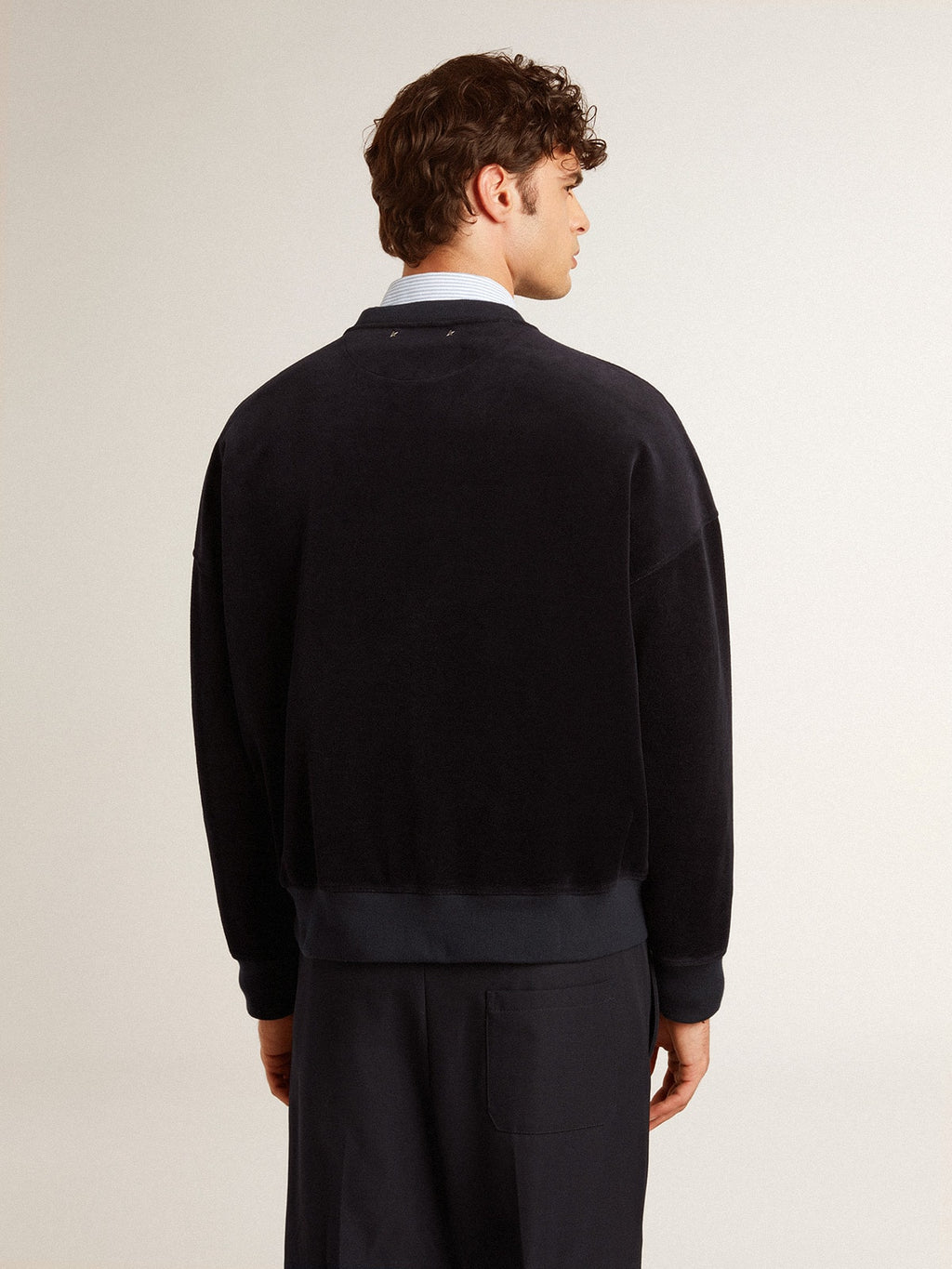Black crew neck sweatshirt with embroidered lettering