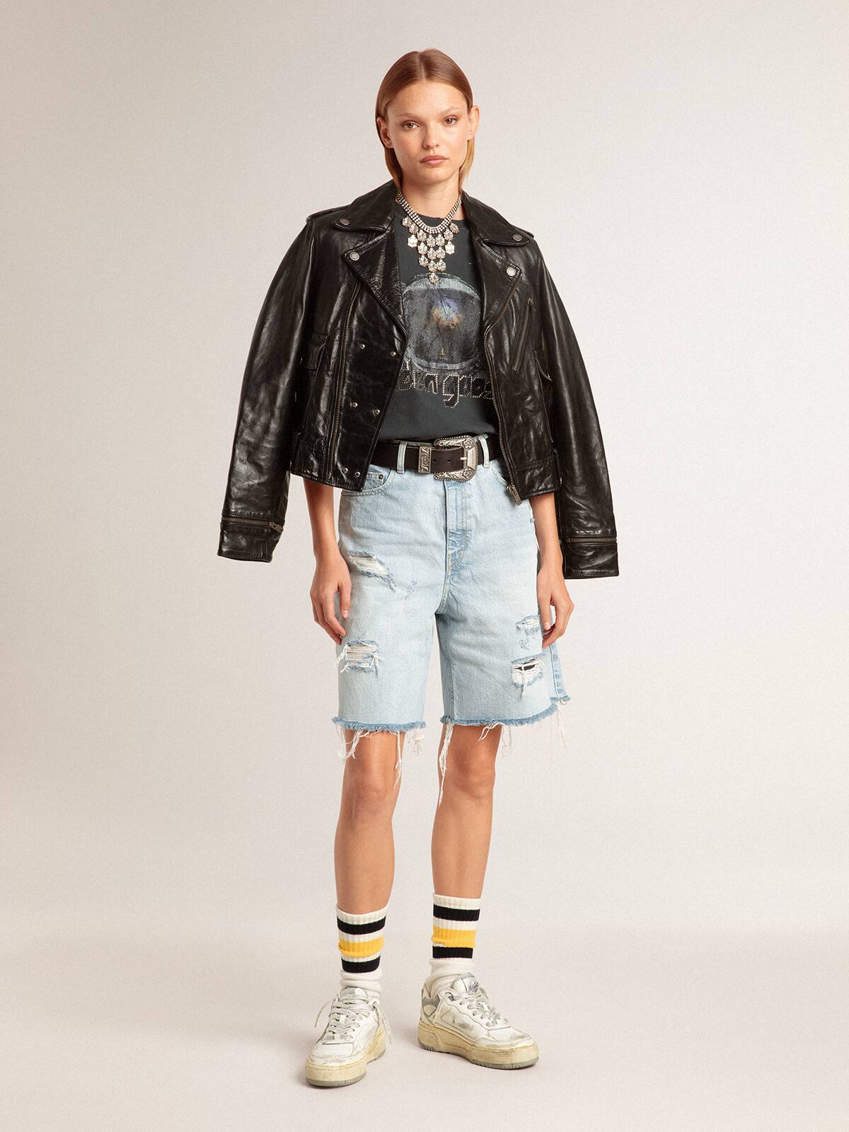 Worn-white socks with distressed details and black and yellow stripes