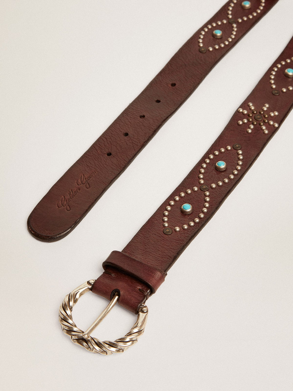 Women's belt in dark brown leather with colored studs