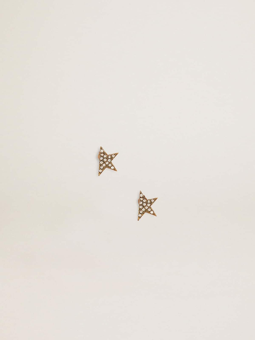 Women's stud earrings in antique gold color with crystals