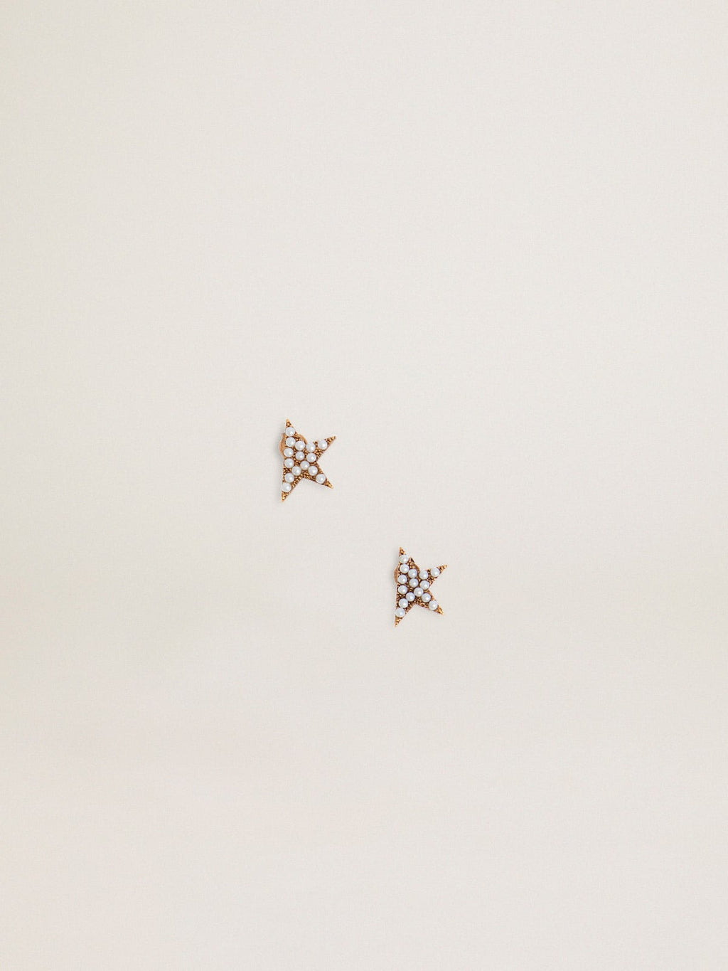Women's stud earrings in antique gold color with decorative beads
