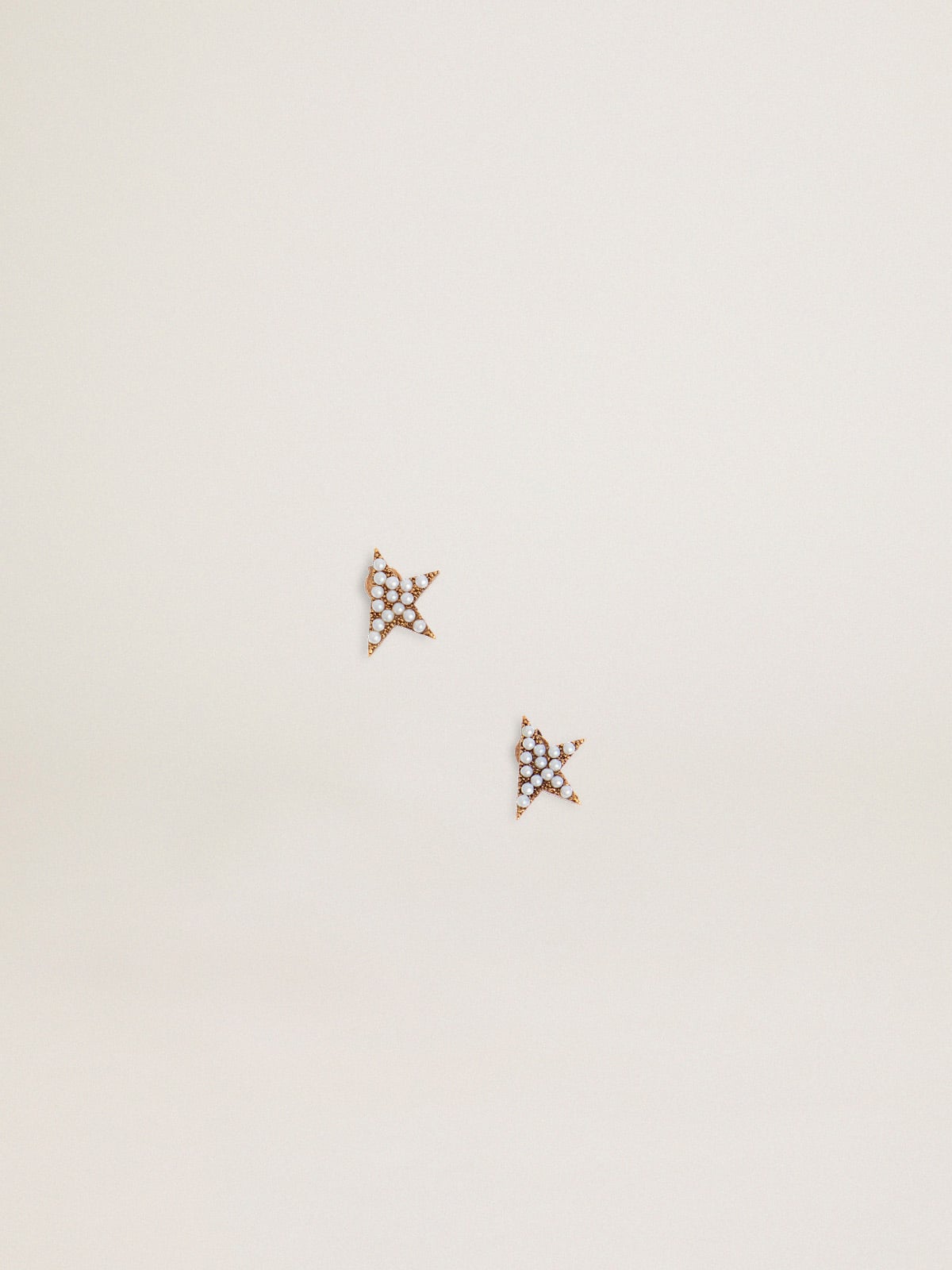 Women's stud earrings in antique gold color with decorative beads
